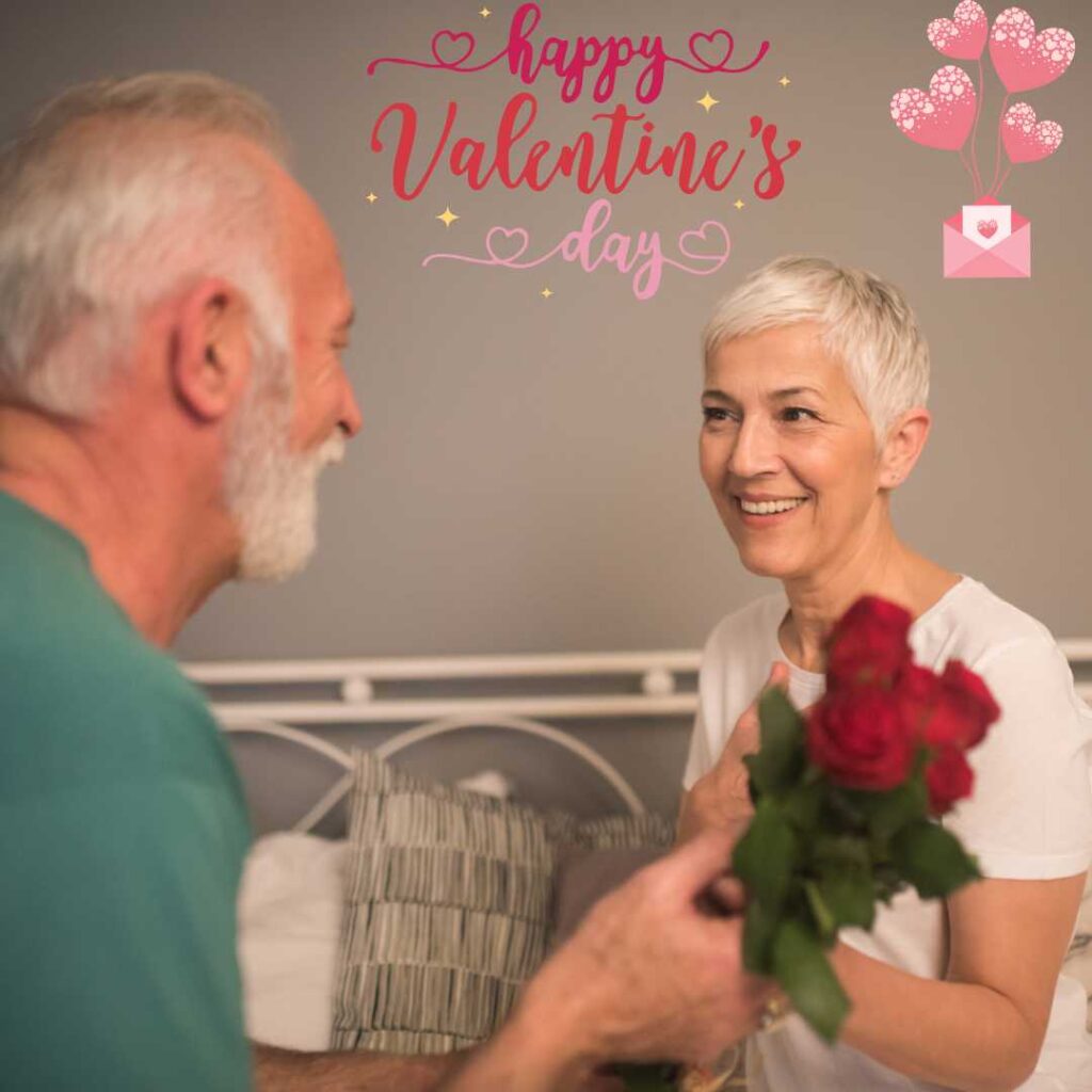 Happy-Valentines-Day-Old-man-giving-flowers-to-his-wife-on-Valentines-Day-and-smiling