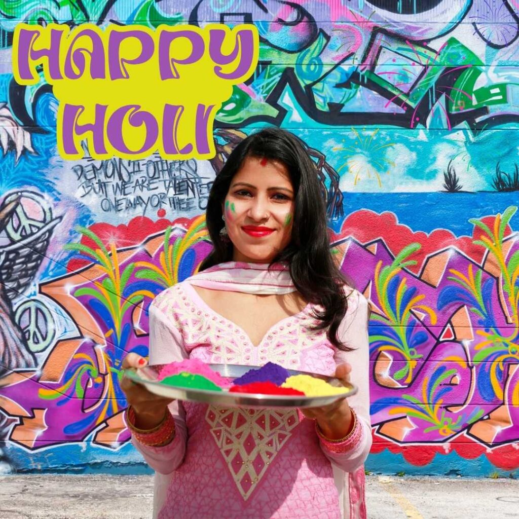 Happy-Holi-A-girl-stands-holding-a-plate-of-colors-on-Holi